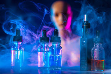 e-cigarettes with lots of different re-fill bottles, close up