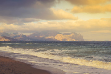Seascape on a stormy sea on a mountain coast on a sunny day