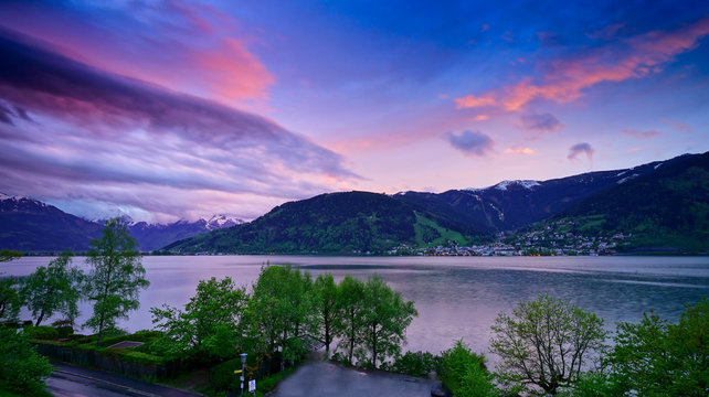 Panoramic view of Zell Am See, Austria during sunset with purple sky