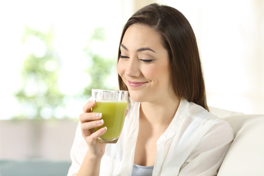 Woman tasting a good vegetable juice