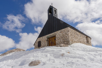 Small church among snow at Zugspitze, Germany
