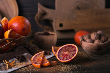 Fresh red orange fruit, anise, cinnamon and walnuts