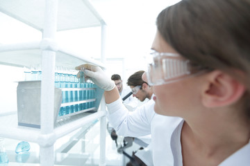 Young woman with test tubes in the laboratory