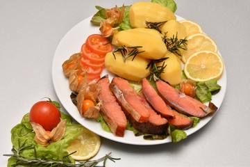 Chinook salmon cold smoking with cooked potatoes