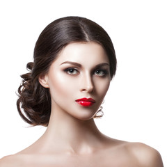 Portrait of a beautiful young woman with a professional make-up on a white background. The ideal beauty.