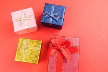 LOVE CONCEPT: Gift boxes isolated on red background. Copy space