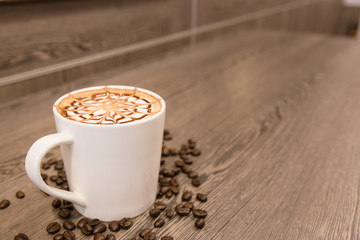 Coffee cup topping with art design for background.