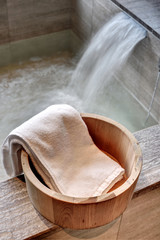 Fototapeta na wymiar Bath bucket with a towel at a hot spring bath at Japanese onsen