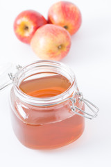 Apple Cider Vinegar and Red Apples on White Background