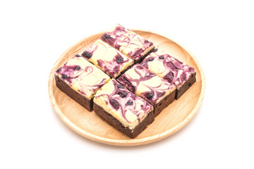 blueberry cheese brownies on white background