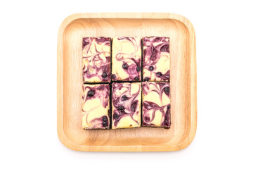 blueberry cheese brownies on white background