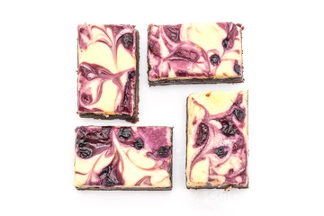 blueberry cheese brownies on white background