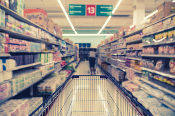 Abstract blurred photo of store with trolley in department store bokeh background, business supermarket and shopping blurred and background concept