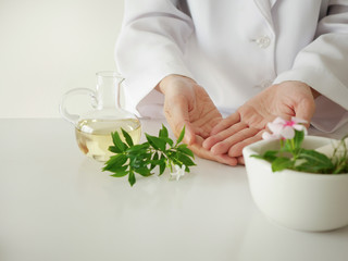 the scientist,dermatologist testing the organic natural cosmetic product in the laboratory.research and development beauty skincare concept.blank package,bottle,container .cream,serum.hand
