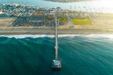 Aerial view of Balboa Pier in Newport Beach Beach, California at sunrise
