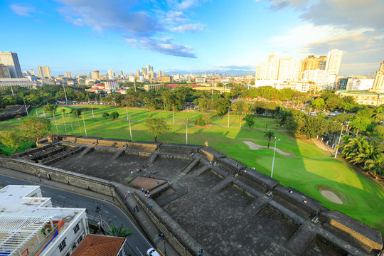 Manila city skyline in Philippines. Ermita and Paco districts seen from Intramuros.