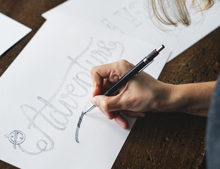 Closeup of a calligrapher working on a project