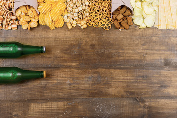 Beer and snacks on a wooden table