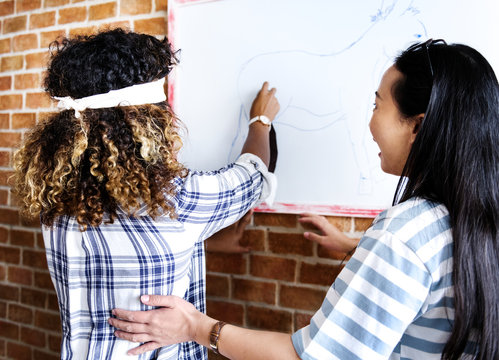 Friends playing game together at home