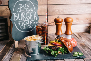 Cheeseburger on a Pretzel Bun With Soft Drink