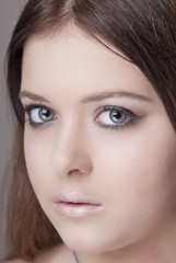 Portrait of a young girl with professional makeup close-up