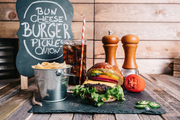 Cheeseburger on a Pretzel Bun With Soft Drink