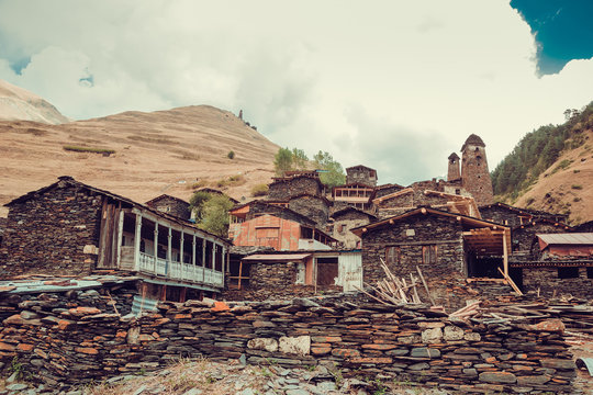 Old village Dartlo with traditional stone buildings and defensive towers in Tusheti. Adventure holiday. Travel to Georgia. Mount landscape. Green ecology tourism. Eco trekking tour. Overcast weather