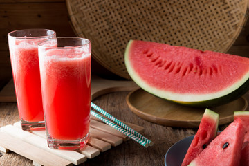 Watermelon smoothie on wood background