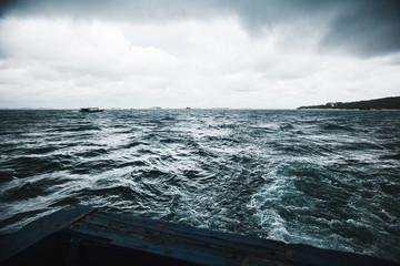 approaching storm on ship. view from the rear deck of the dark water. sea element in boat.
