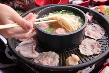 Grilled pork on a shabu pan