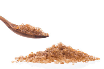 Brown rock sugar isolated on white