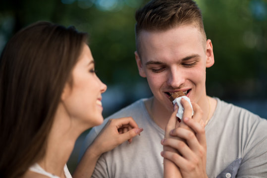 Teen Woman Sharing Chocolate Bar