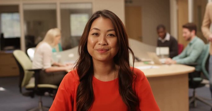 4K Smiling friendly businesswoman making a video conference call in the office