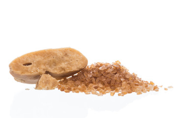 Dried palm sugar isolated on white