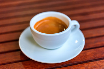 cup of coffee on the wooden table