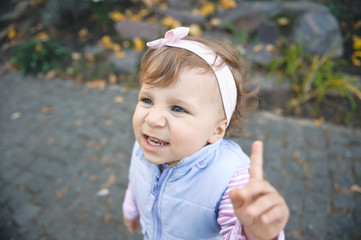 Girl Holding Finger up