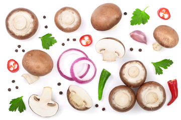 Fresh champignon mushrooms with parsley, peppercorns and red hot chili peppers isolated on white background. Top view