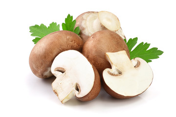 Royal Brown champignon with half and parsley leaf isolated on white background