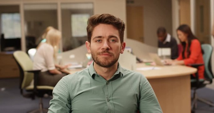 4K Businessman pretending to look interested during very boring conference call