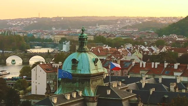 Prague, Czech Republic. Panoramic View Of Evening Cityscape In Sunset Time. Straka Academy, Charles Bridge In Prague, Czech Republic. Pleasure Boat Moving In In Vltava River
