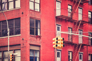 Obraz premium New York City traffic lights with building on background , color toned picture, USA.