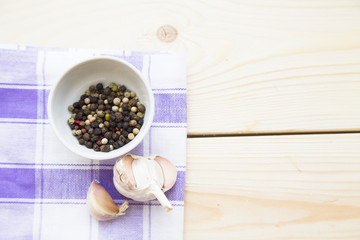 Cooking concept - papper, garlic on wooden table. Set of healthy food products are sources of vitamins and minerals. Closeup, top view