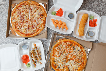 Pizza and sushi. Delivery in containers and boxes
