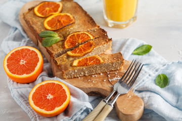 Healthy homemade vegan orange cake with coconut, copy space. Healthy vegan food concept.