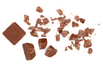 Chocolate pieces isolated on white. Top view. Flat lay