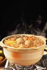 Cooking spicy hot pot boiling on the fire burning stove    