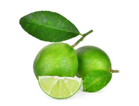 fresh green lime with green leaves isolated on white background