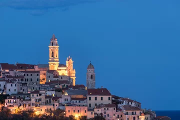 Fototapeten The old town of Cervo, Liguria, Italy, with the beautiful baroque church arising from the houses. Clear blue sky. © fabio lamanna