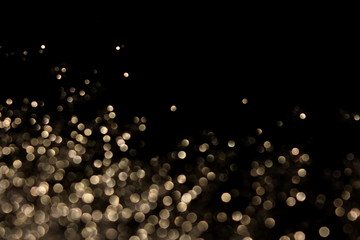 красивый фон с блестками и боке на черном фоне        