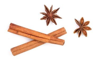 Cinnamon sticks and star anise isolated on white background. Top view
